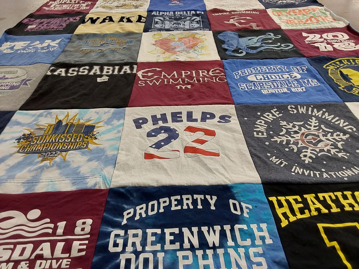 T-shirt quilt featuring greenwich dolphins, empire swimming by Jennifer from NY