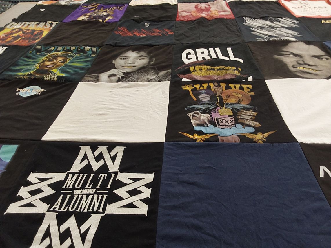 T-shirt quilt with music, pop culture themes by Obiorah from GA