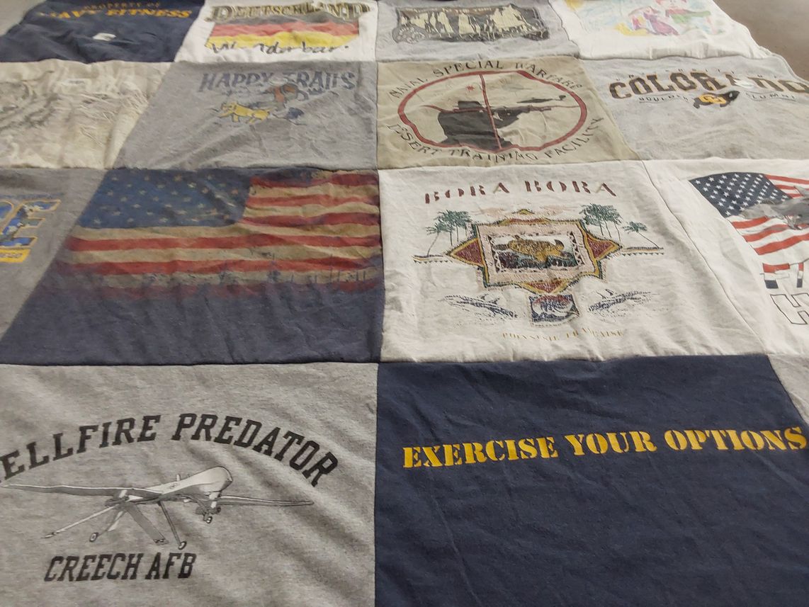 T-shirt quilt with travel, military themes by Betsy from CA