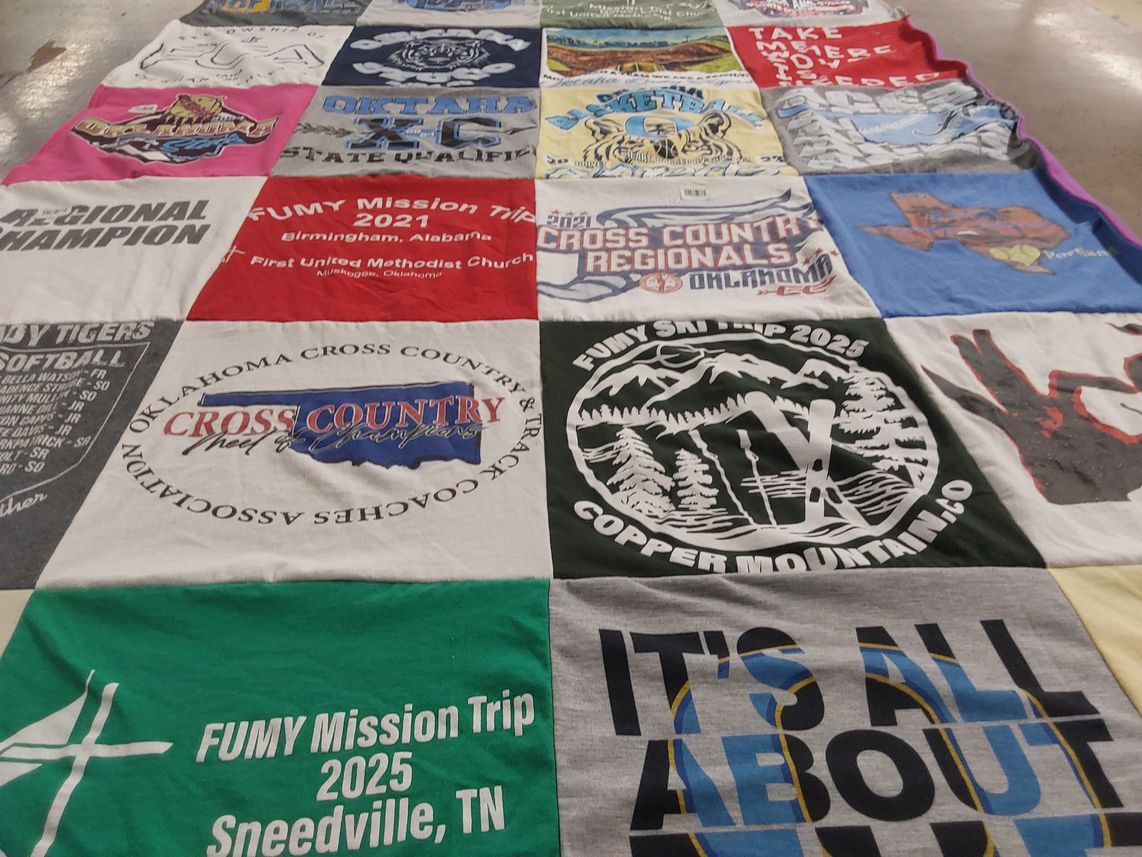 T-shirt quilt with community service, sports themes by Laura from OK