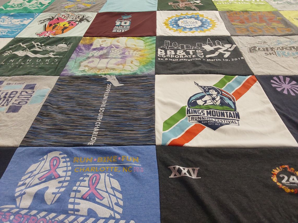 T-shirt quilt with running, biking themes by Michelle from NC