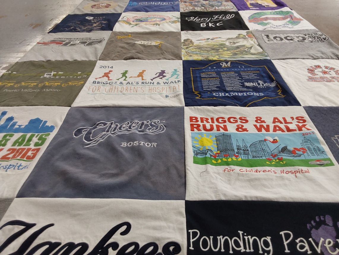 T-shirt quilt with charity, community themes by Joanne M from FL