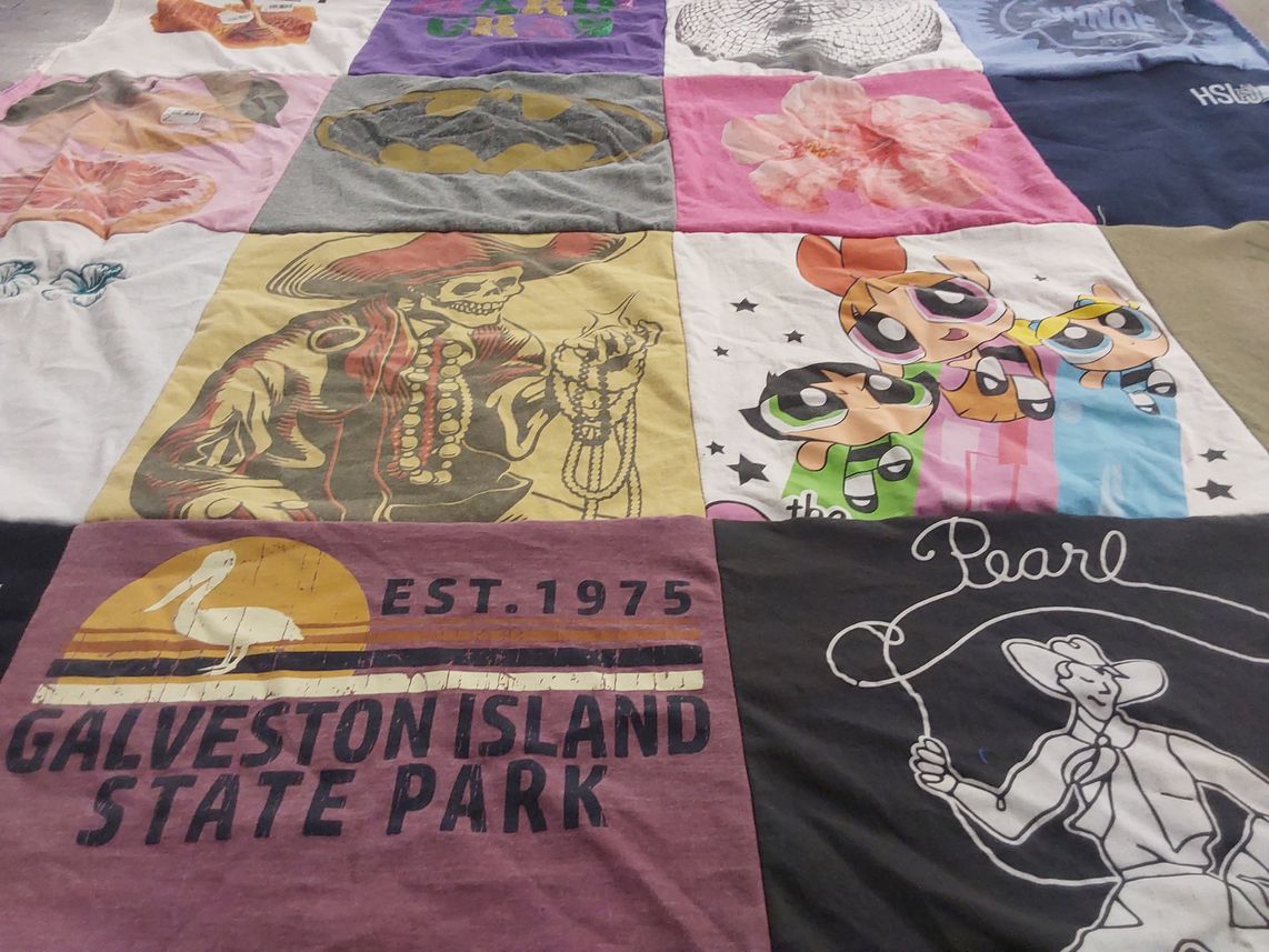 T-shirt quilt with cartoons, outdoors themes by Trudi from TX
