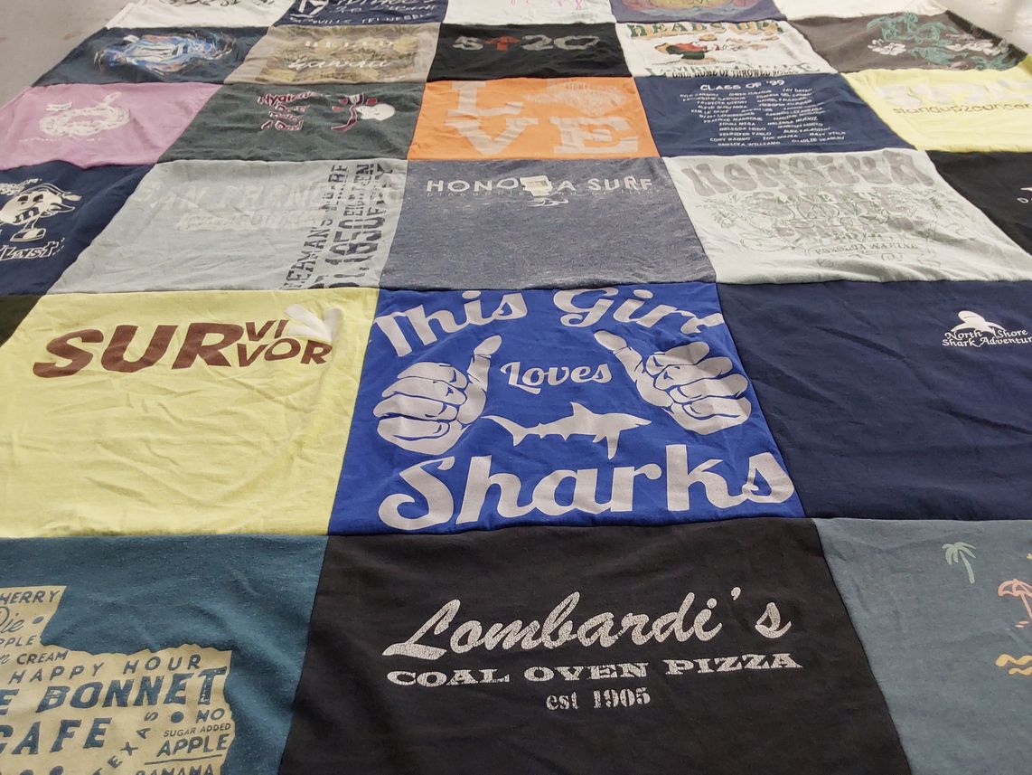 T-shirt quilt with sharks, pizza themes by Jackie from UT
