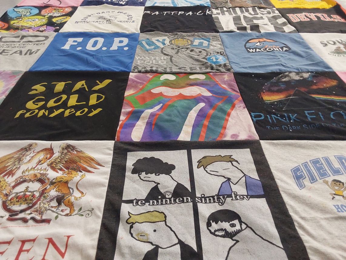 T-shirt quilt with music, movies themes by Laura from IL