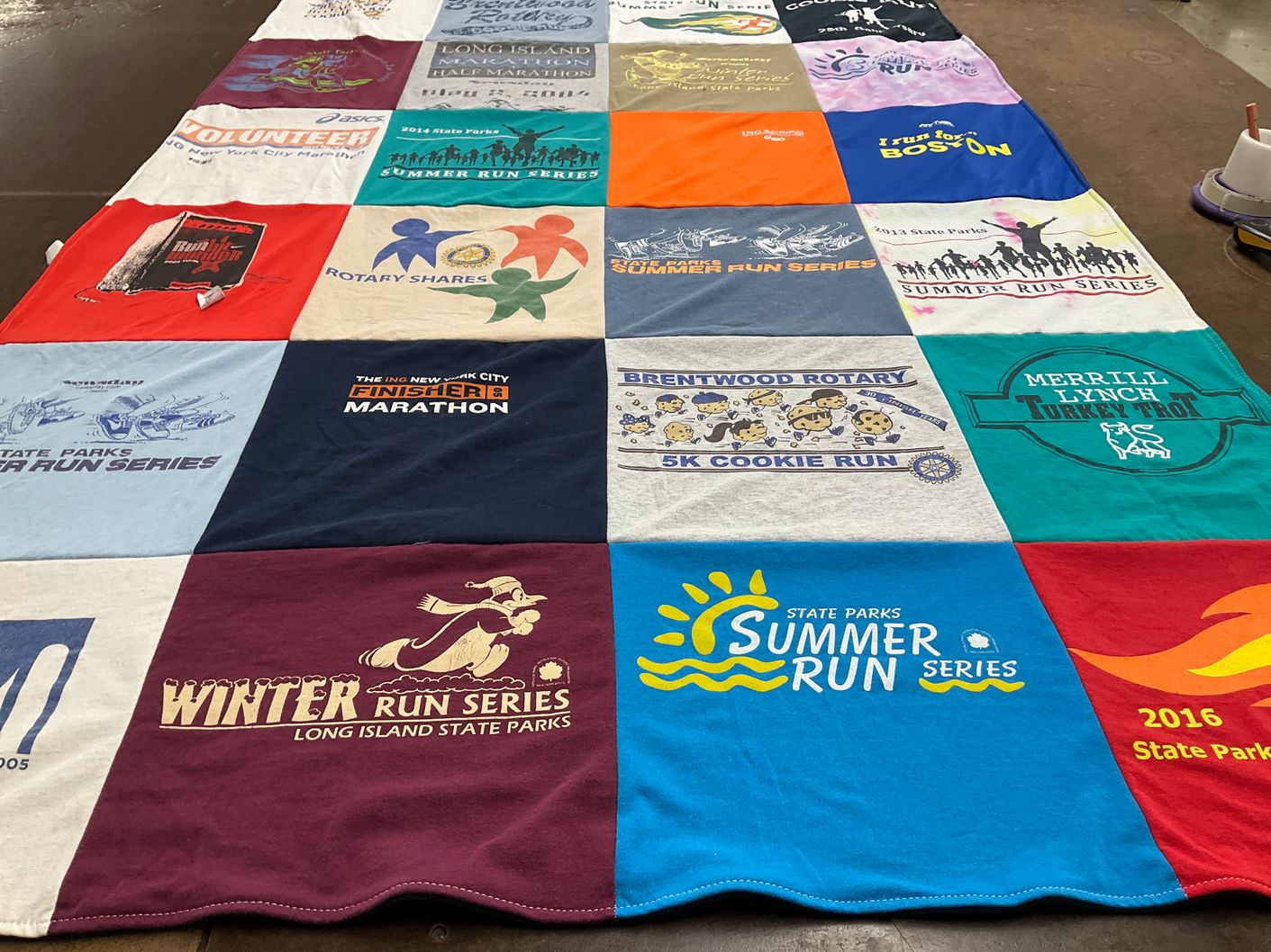 T-shirt quilt with running, volunteering themes by Renée from NY