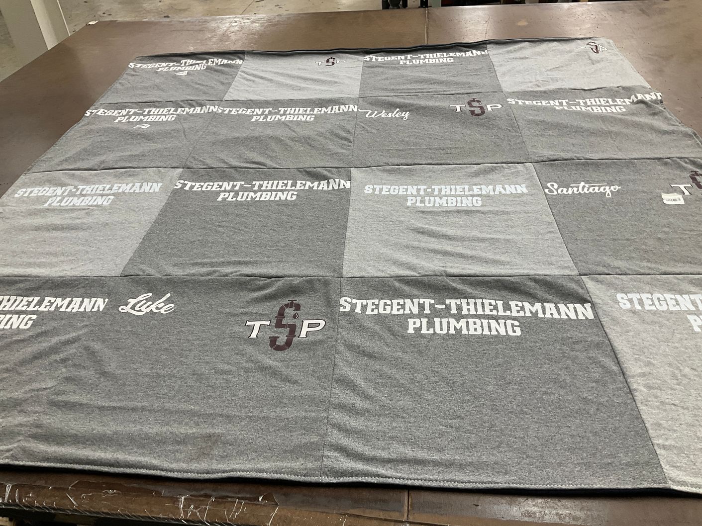 T-shirt quilt with plumbing themes by Yolanda from TX