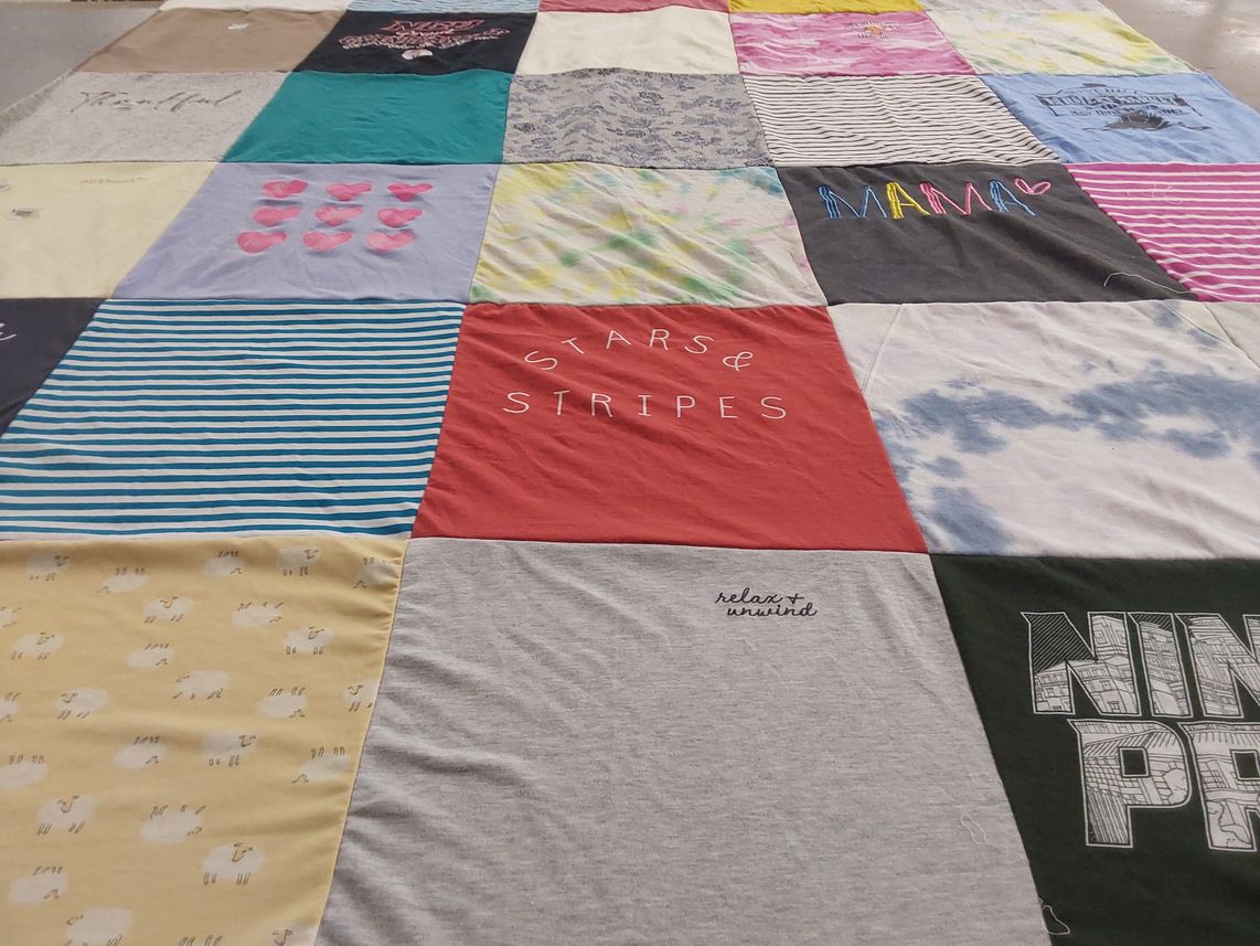 T-shirt quilt with family, relaxation themes by Robin from NC