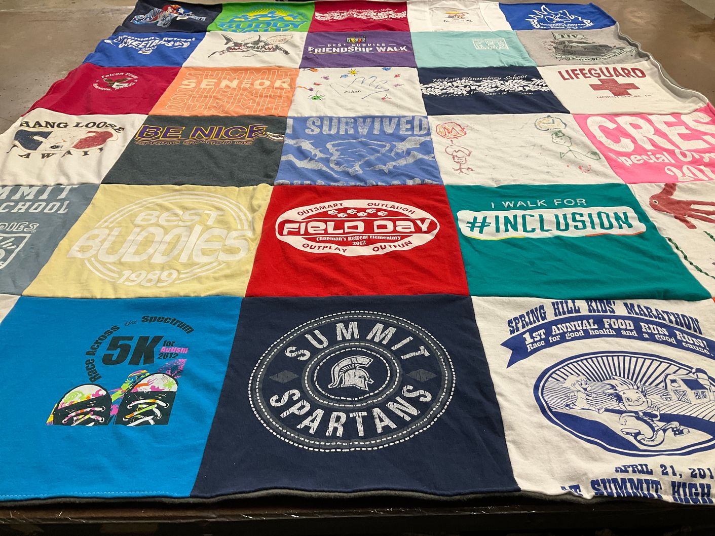 T-shirt quilt featuring summit spartans by Colleen from TN