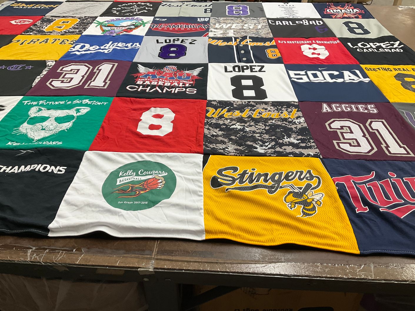 T-shirt quilt featuring kelly cougars, stingers by Ben from CA