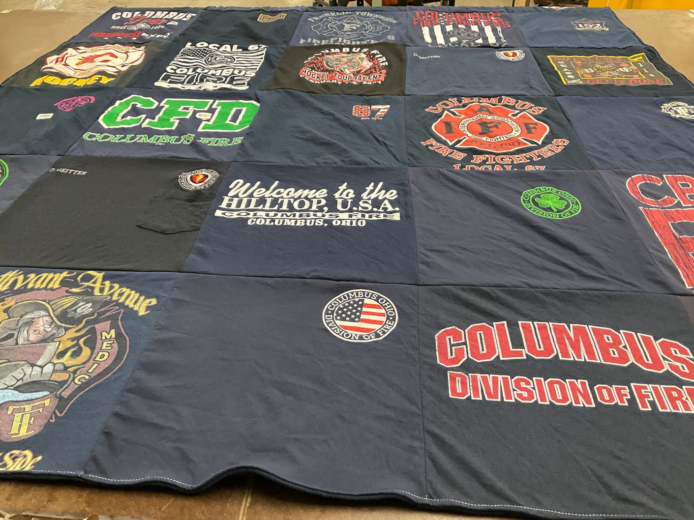 T-shirt quilt with firefighting, community service themes by Crystal from OH