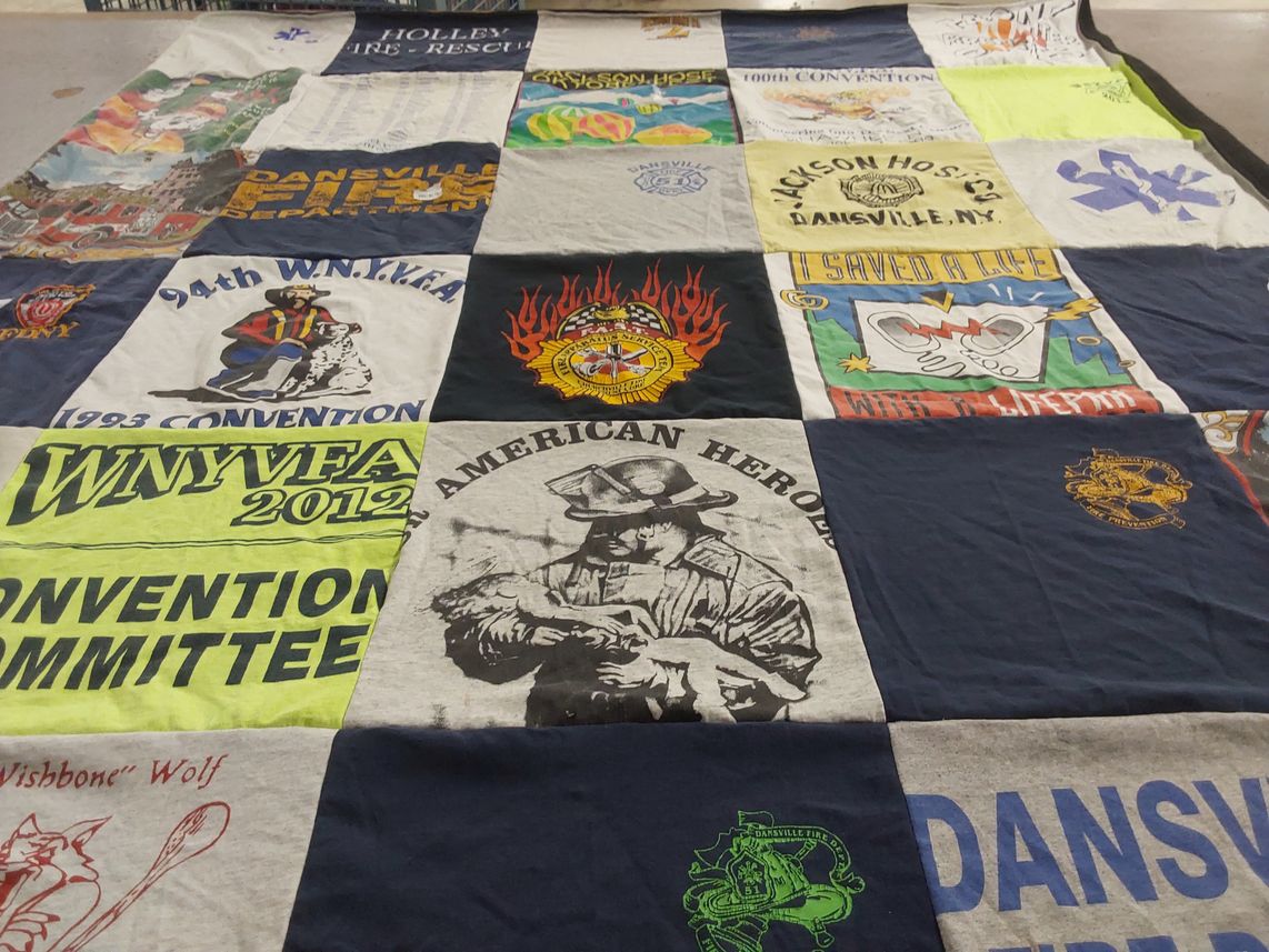 T-shirt quilt with firefighting, community service themes by Dawn from NY
