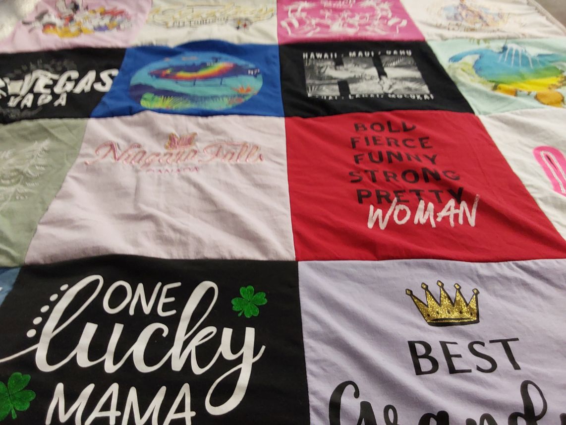 T-shirt quilt with travel, family themes by Linda from NC