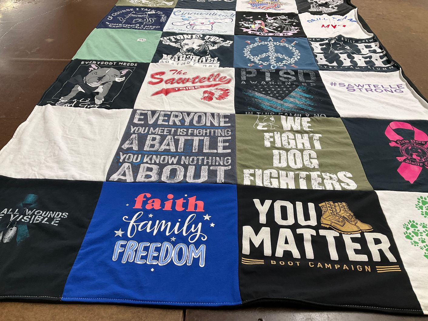 T-shirt quilt with mental health awareness, animal rescue themes by Brenda from NY