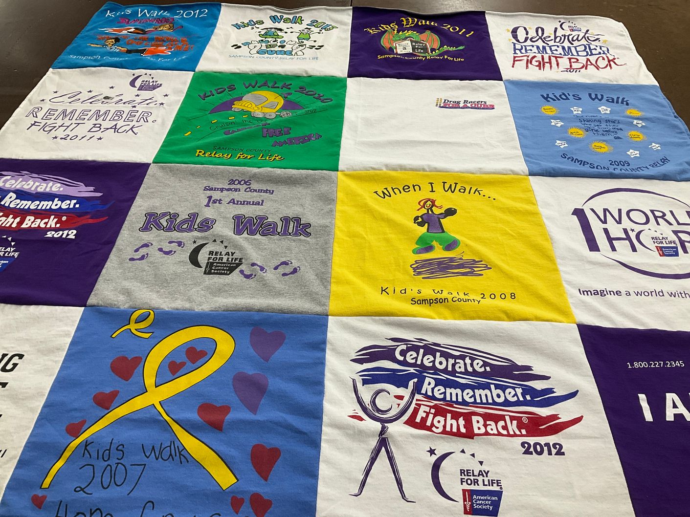 T-shirt quilt with fundraising, community themes by Ingrid from NC