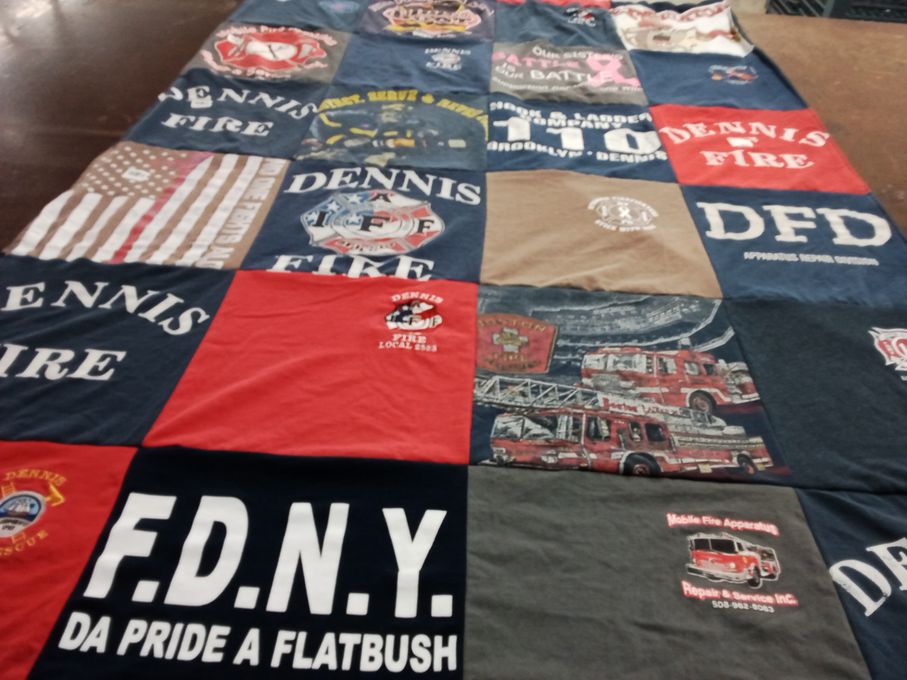 T-shirt quilt with firefighting, community service themes by Leah from MA