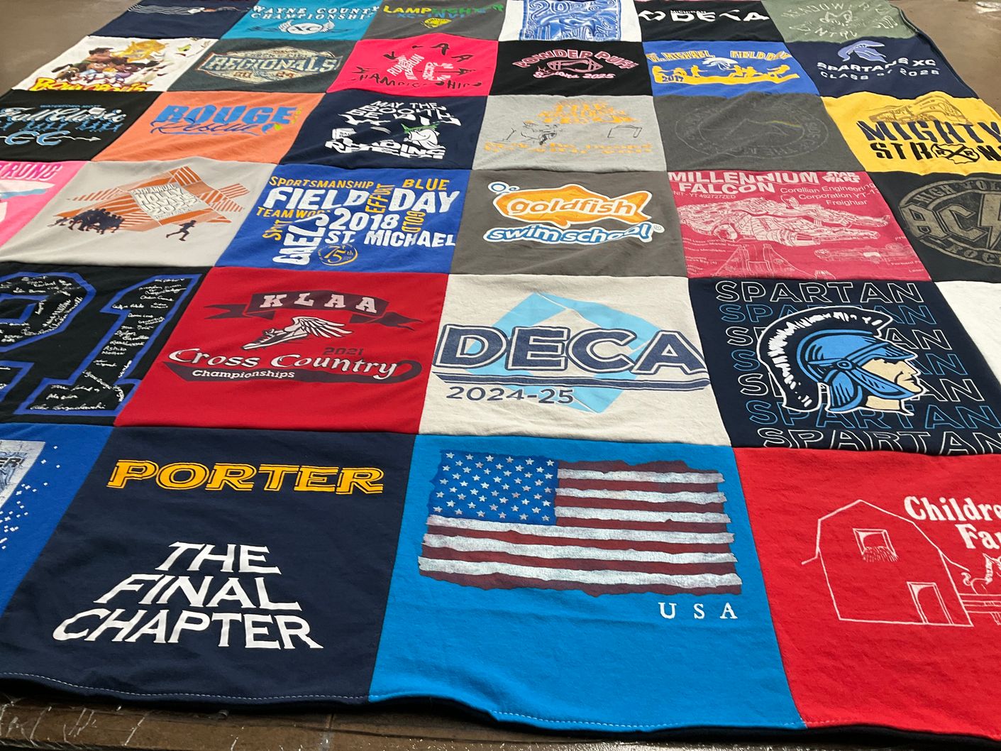 T-shirt quilt featuring spartan cross country team by Andrea from MI