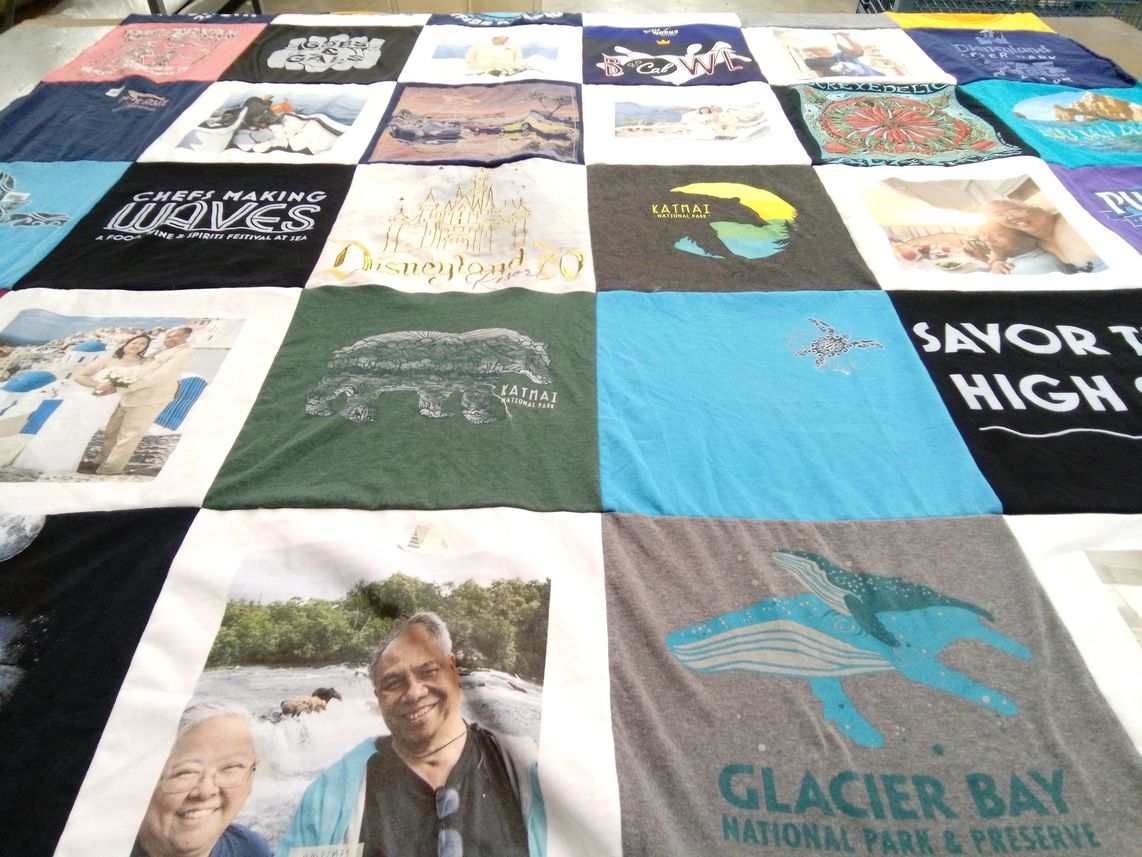 T-shirt quilt with national parks, food festivals themes by Maria from CA
