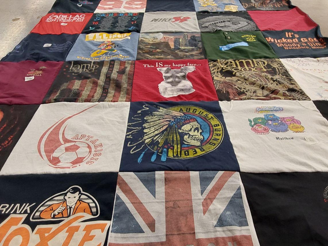 T-shirt quilt with soccer, graduation themes by Joanna from IL