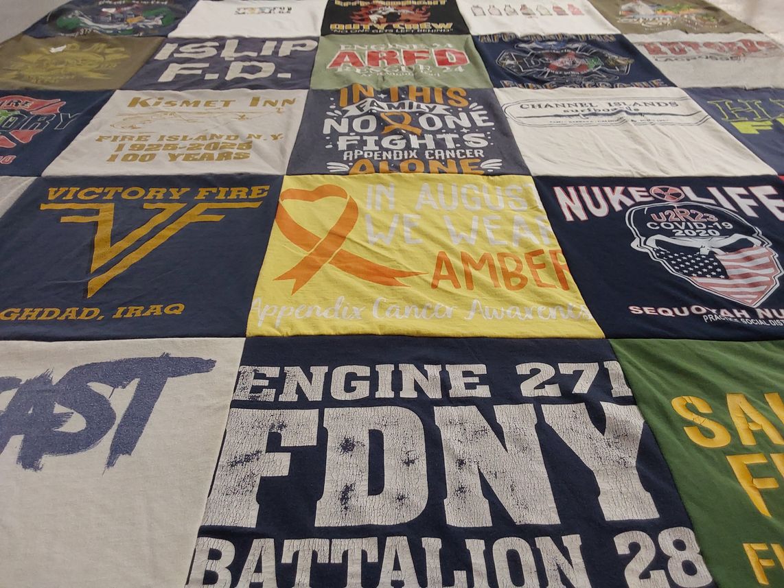 T-shirt quilt with firefighting, community service themes by Rebecca from IL