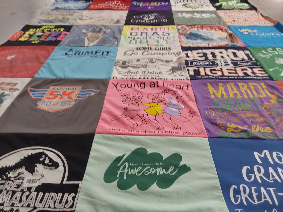 T-shirt quilt with mardi gras, camping themes by Michelle from OK