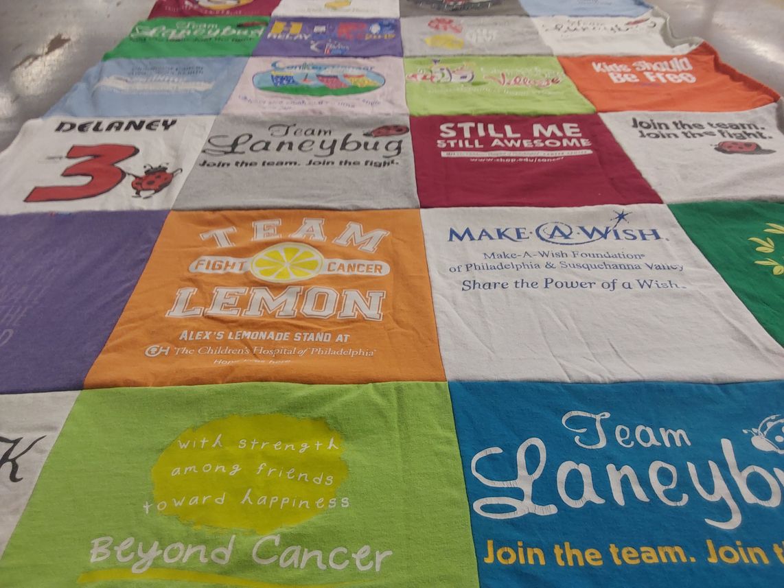 T-shirt quilt with cancer awareness, fundraising themes by Linda from PA