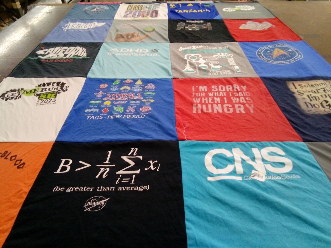 T-shirt quilt with running, science themes by Katy from CA