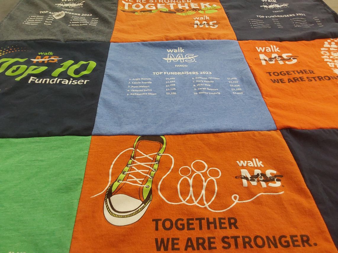 T-shirt quilt with health awareness, fundraising themes by Patti from ND
