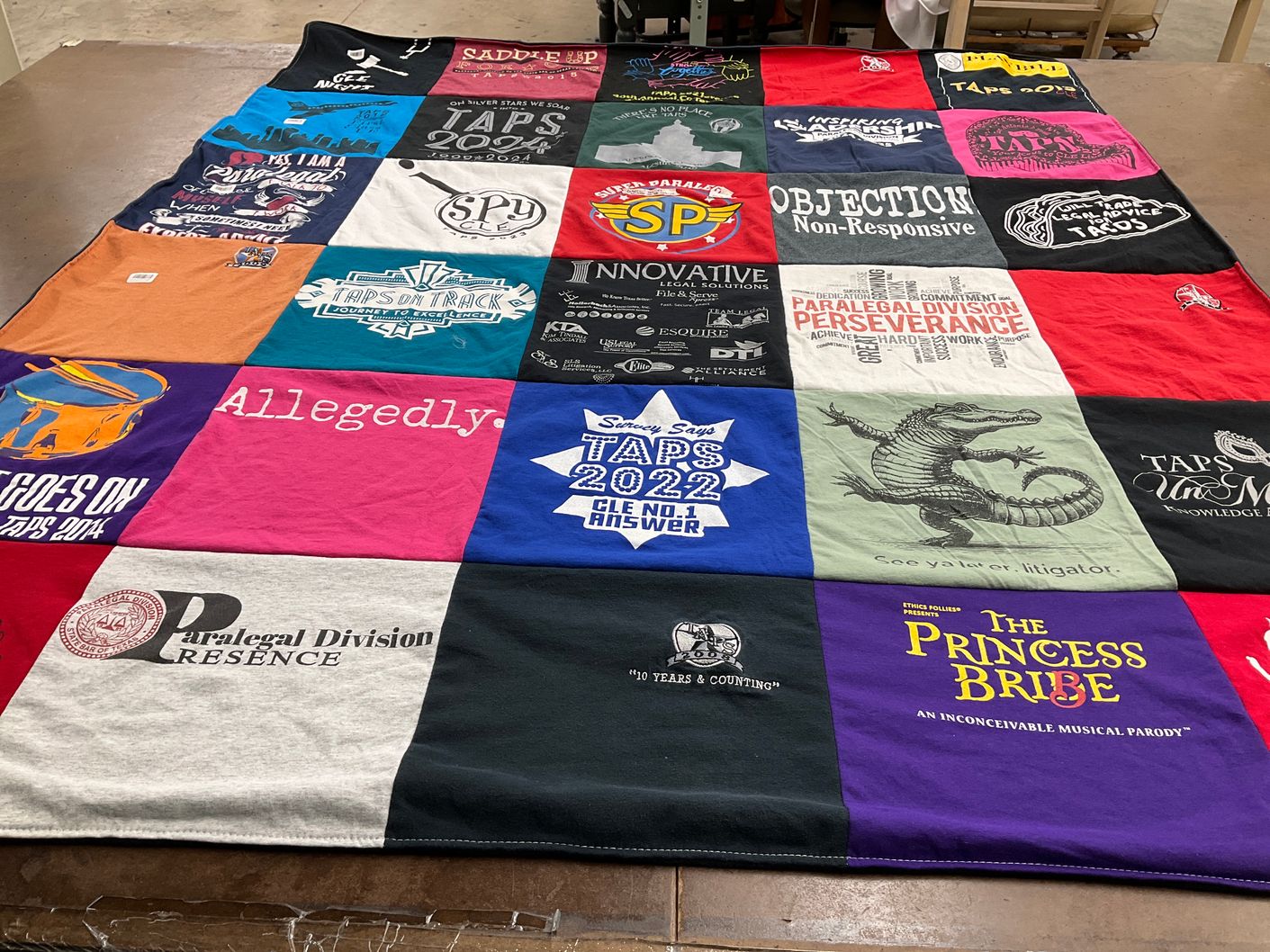T-shirt quilt with law, theater themes by Susi from TX
