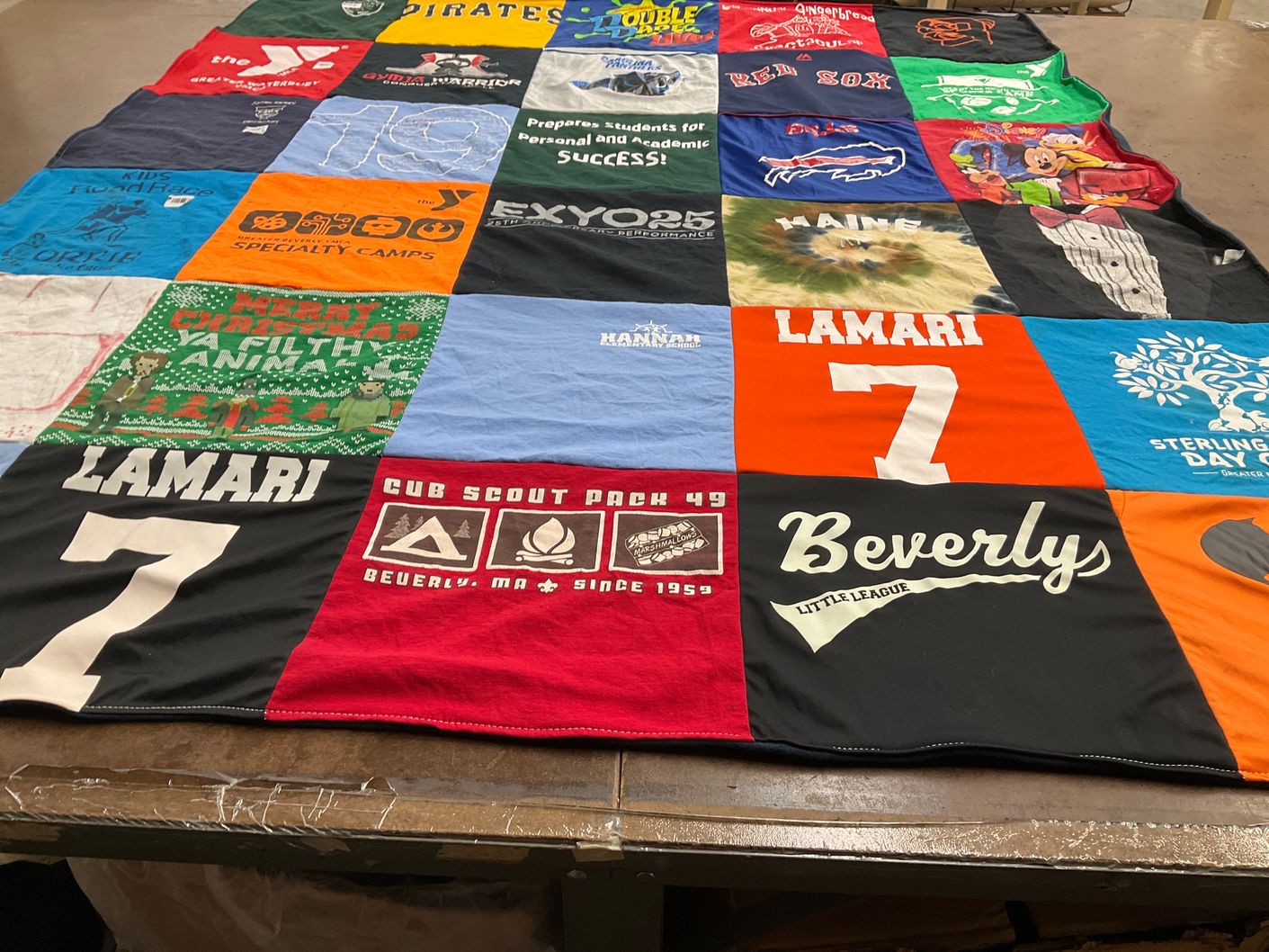 T-shirt quilt with sports, scouting themes by Joann from MA