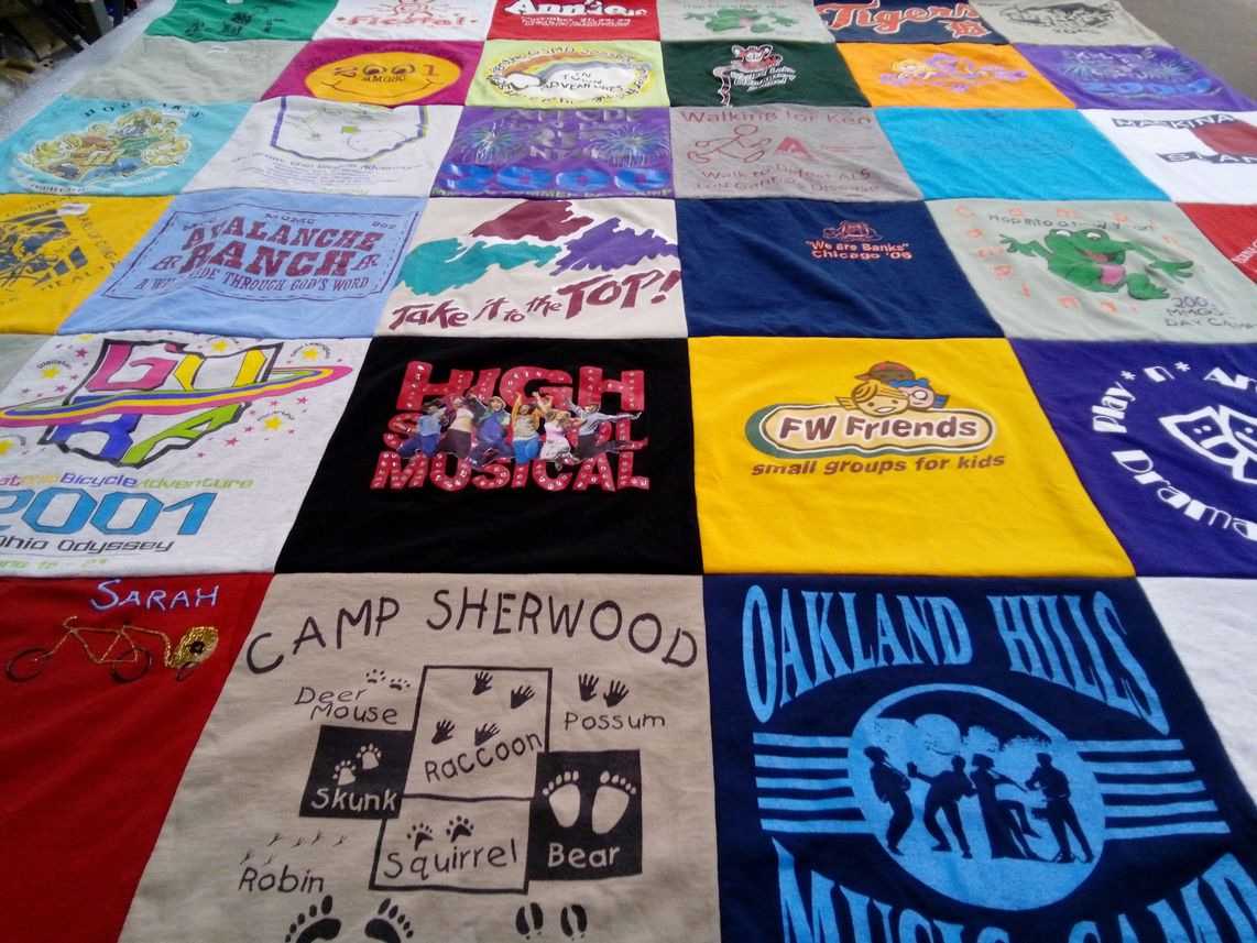 T-shirt quilt with camping, theater themes by Vicki from MI