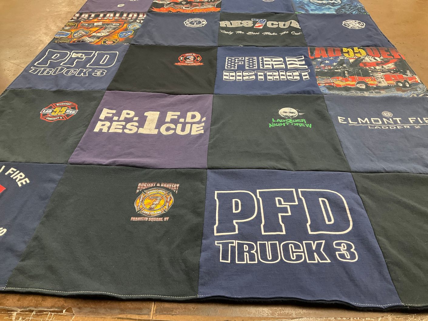 T-shirt quilt with firefighting, emergency response themes by Debbi from FL