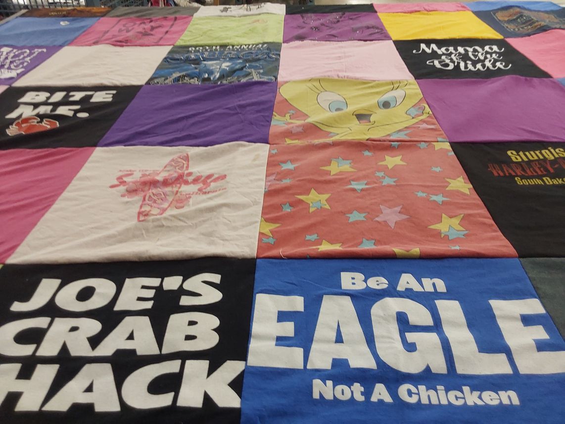 T-shirt quilt with seafood, biking themes by Amanda from MS