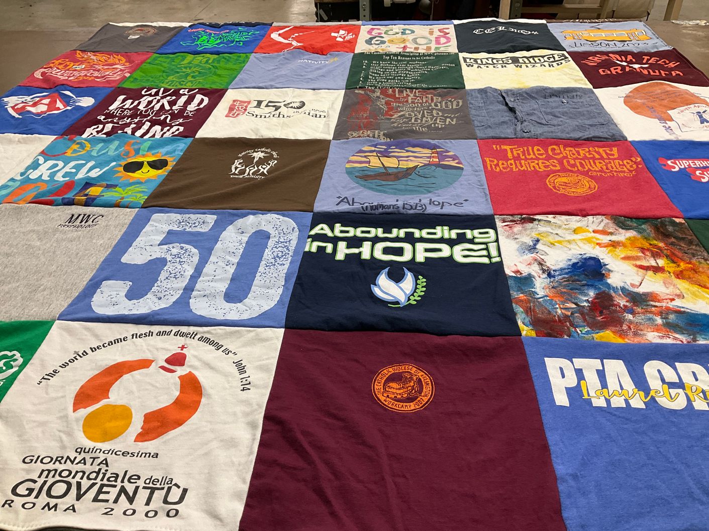 T-shirt quilt with youth events, community service themes by Aimee from VA