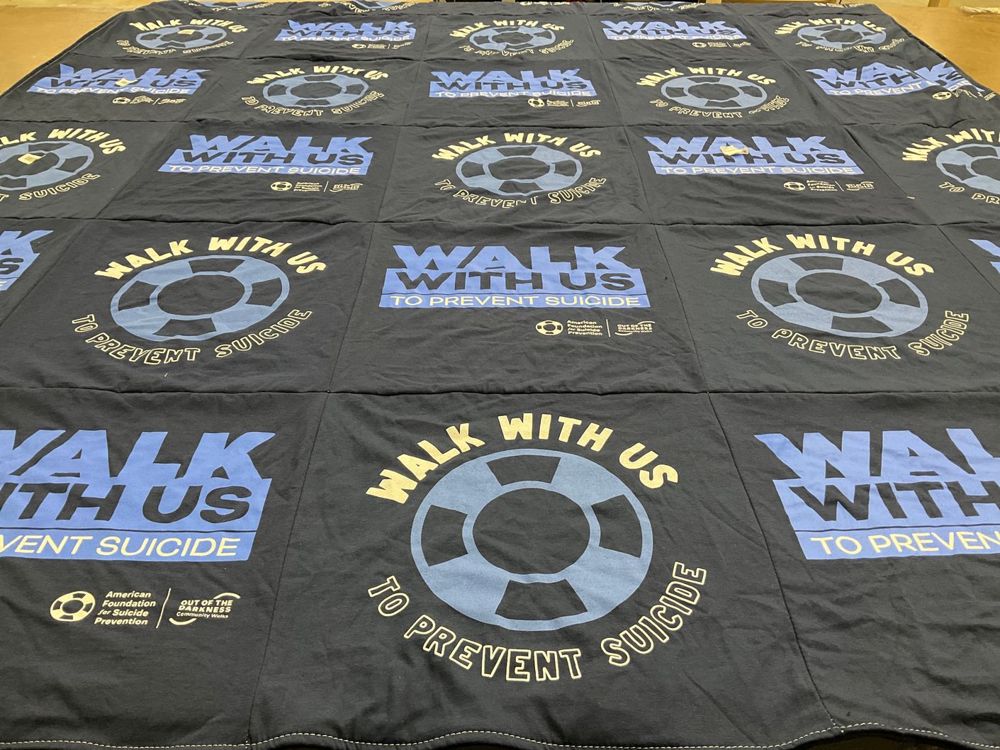 T-shirt quilt with mental health, suicide prevention themes by Jane from MI