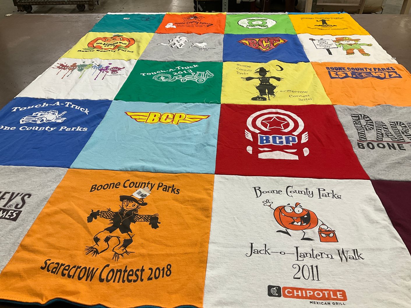 T-shirt quilt with community events, festivals themes by Maria from KY