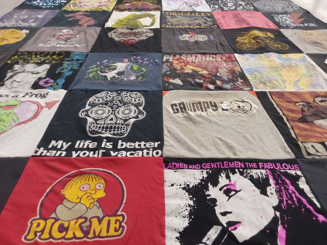 T-shirt quilt with cartoons, music themes by Sarah from FL