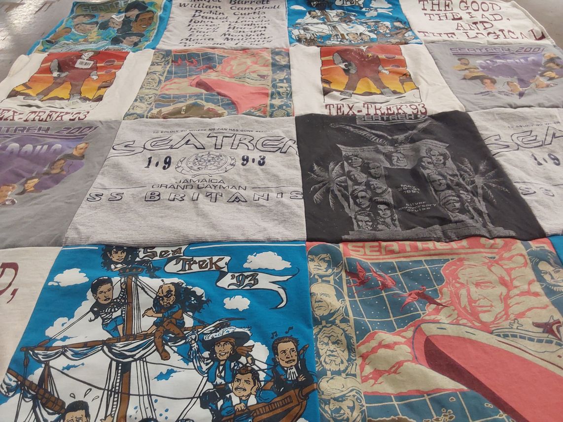 T-shirt quilt with science fiction, community events themes by Karen from TX