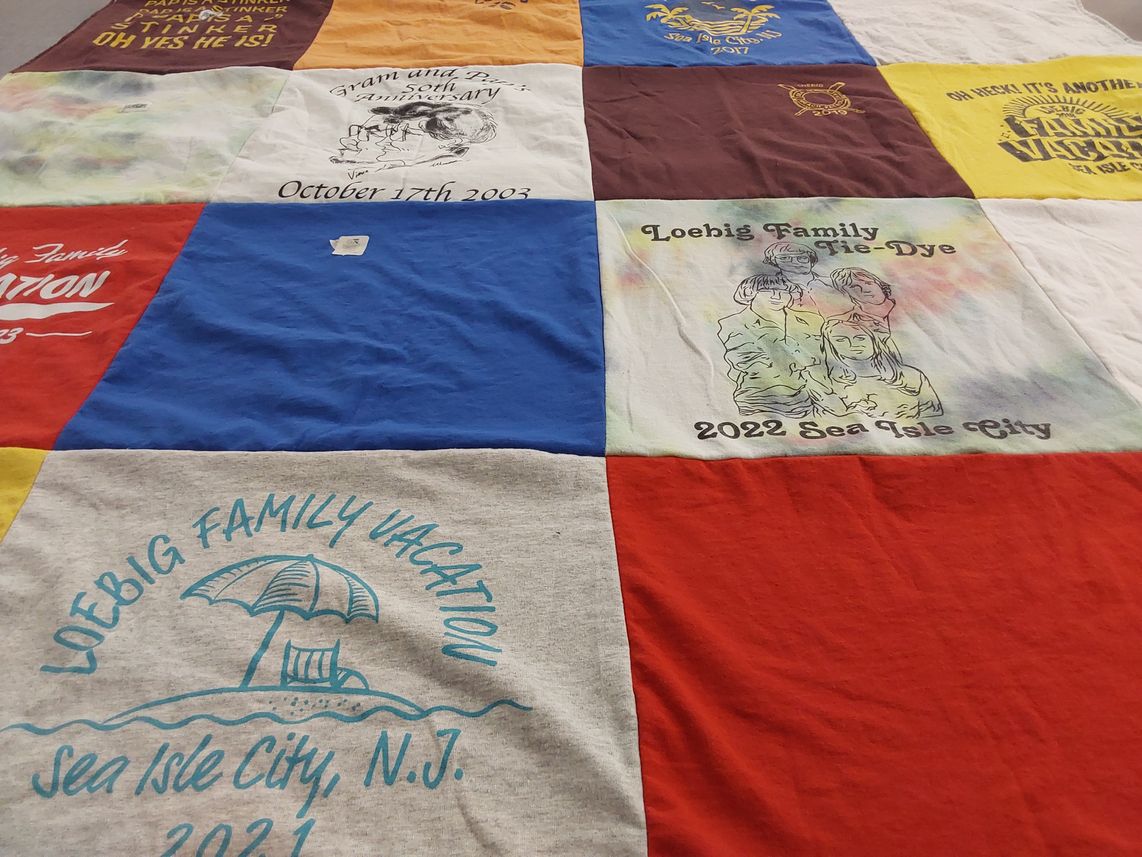 T-shirt quilt with family gatherings, vacations themes by Joyce from OH