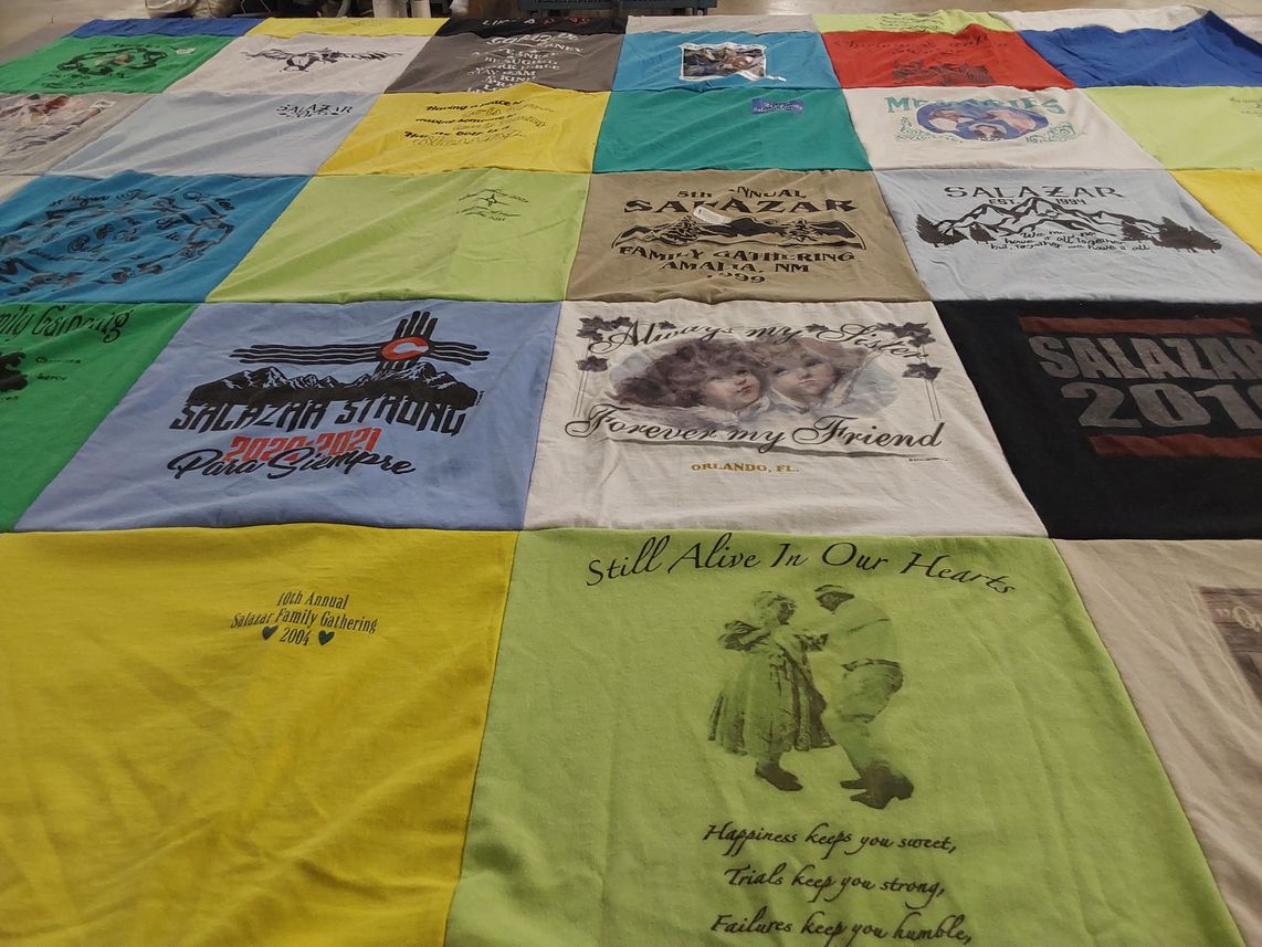 T-shirt quilt with family, community themes by Sarah from NM