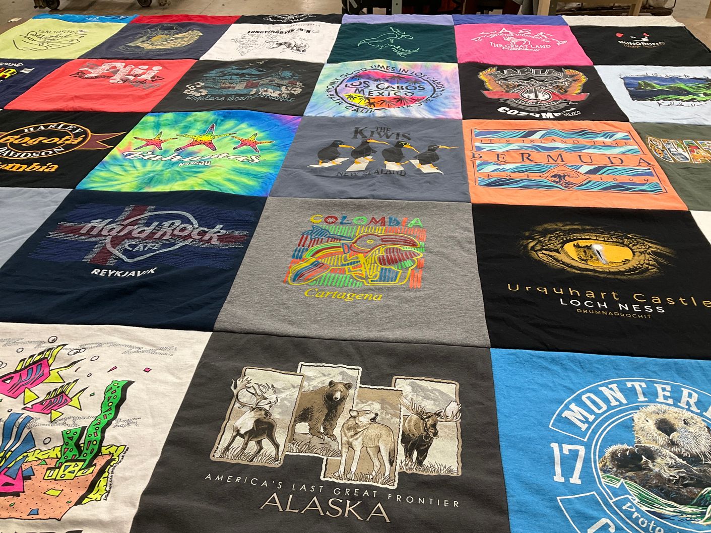 T-shirt quilt with travel, music themes by Sally from NV