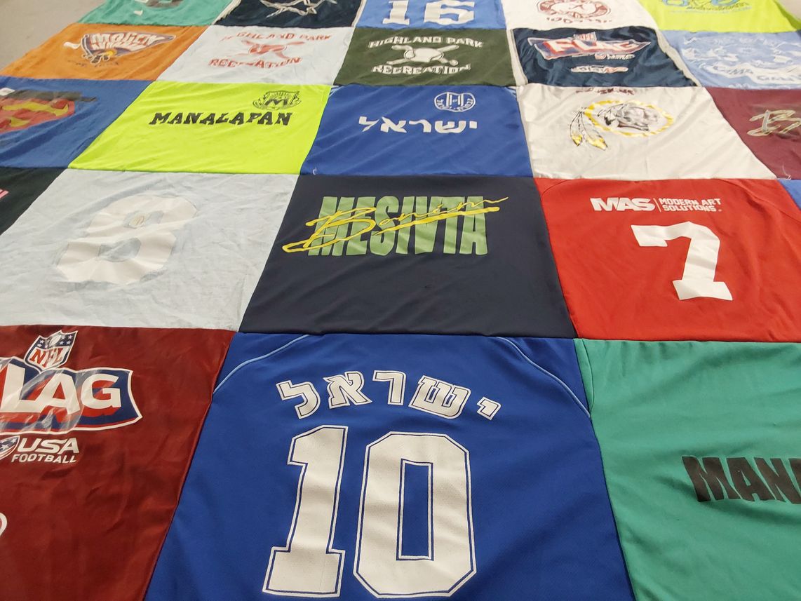 T-shirt quilt with football, art themes by Jennifer from NJ