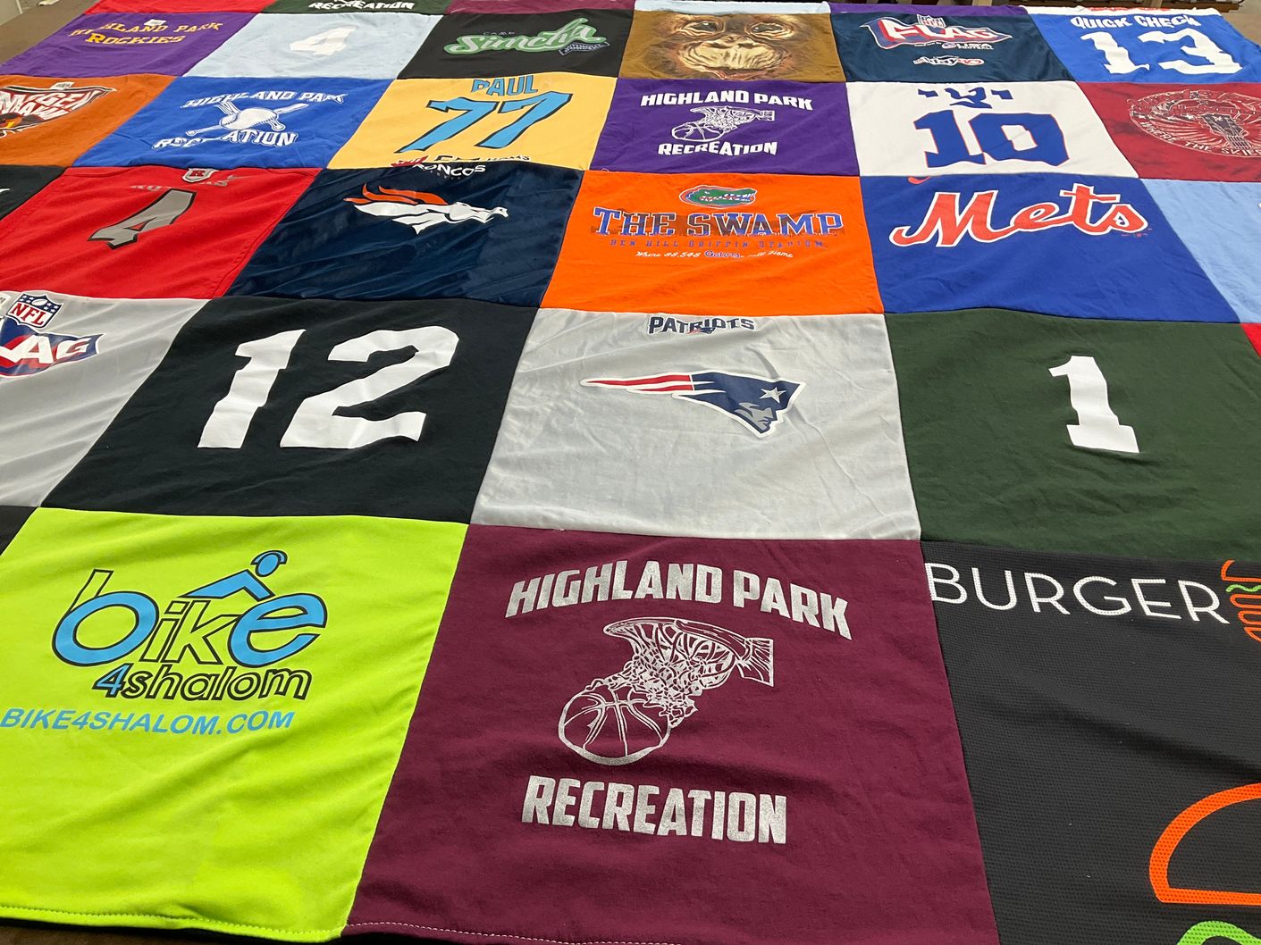 T-shirt quilt with sports, recreation themes by Jennifer from NJ