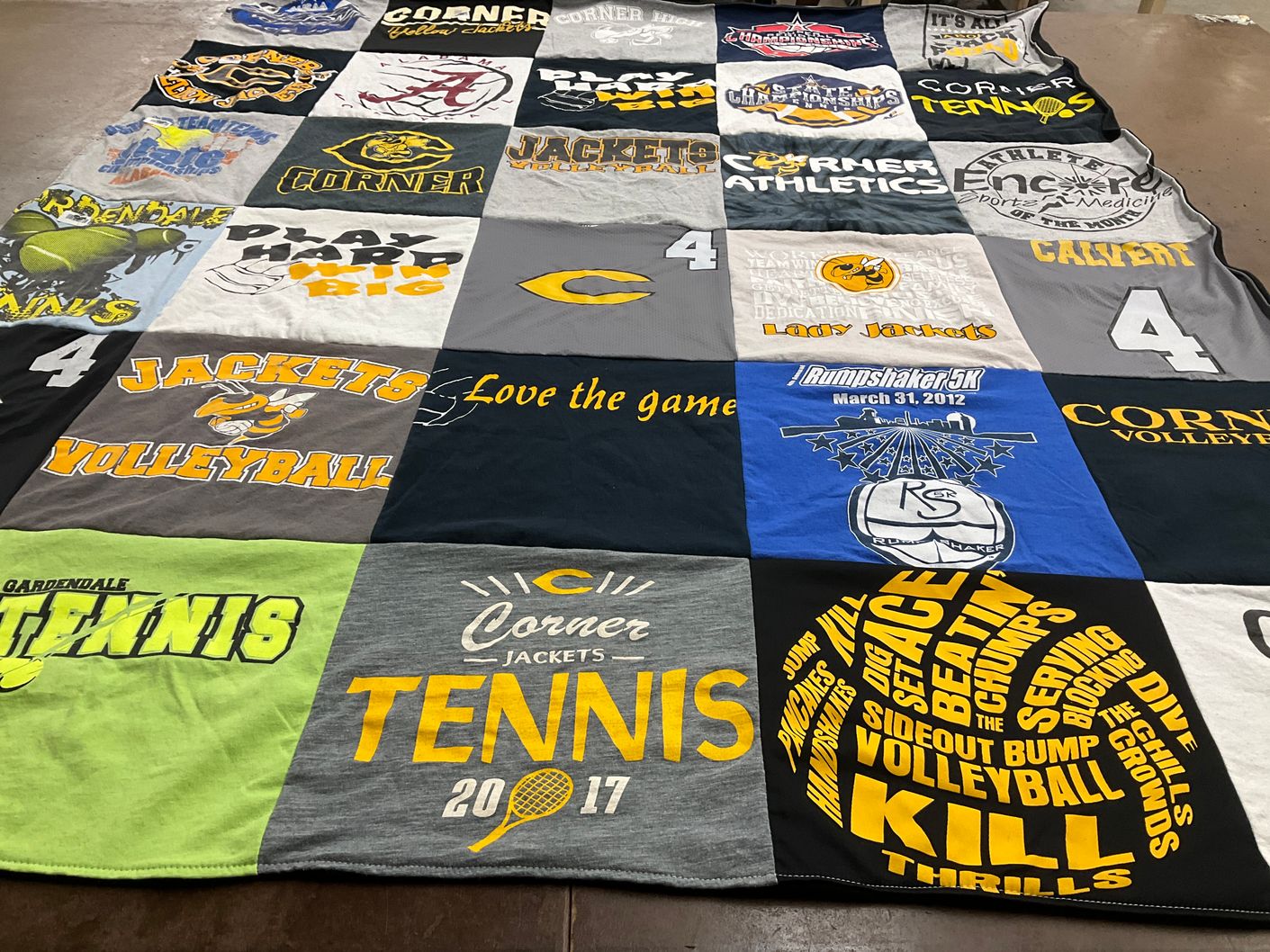 T-shirt quilt featuring corner jackets by Amy from AL