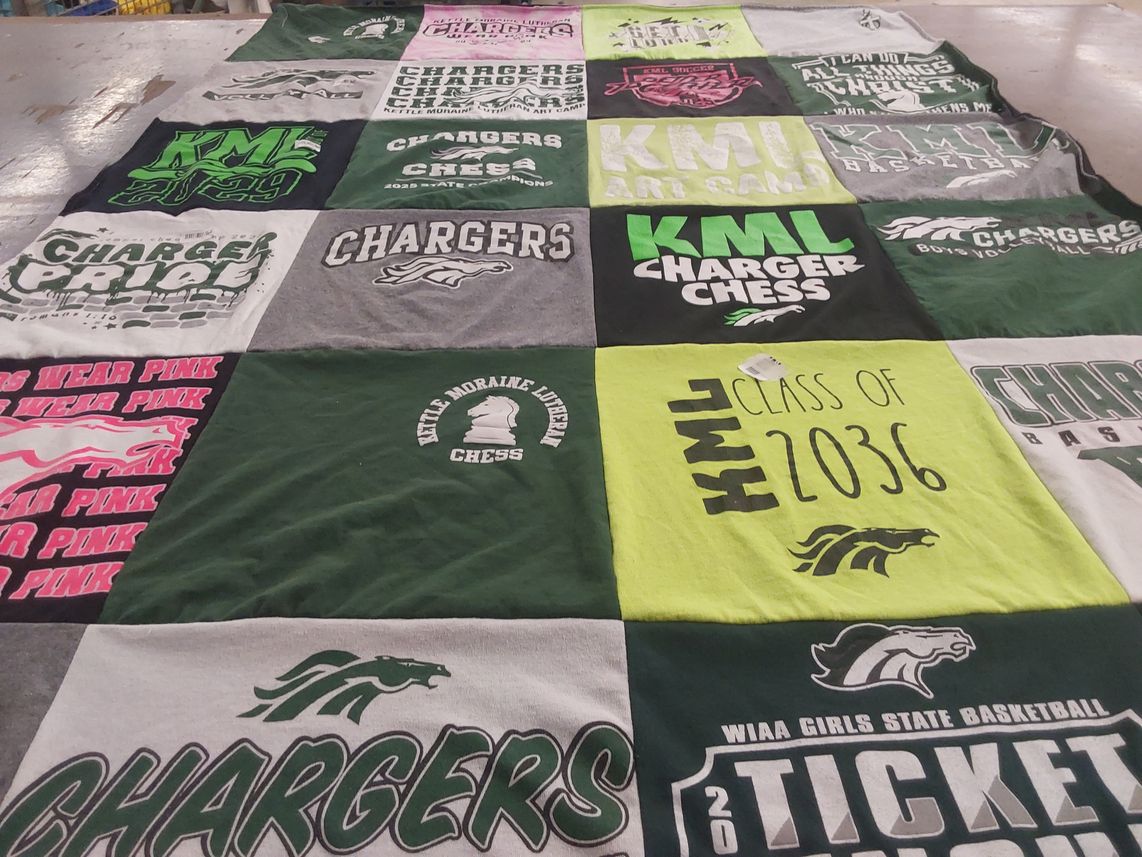 T-shirt quilt featuring kettle moraine lutheran high school chargers by Peter from WI
