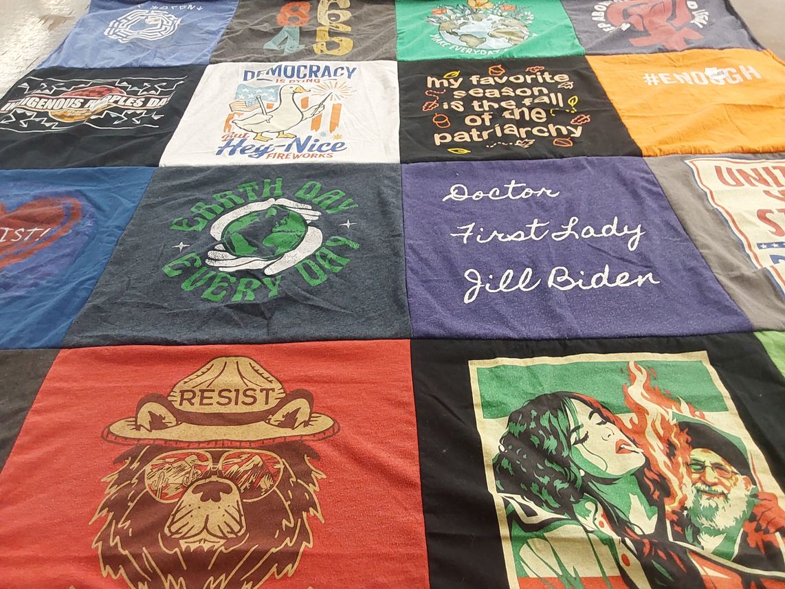 T-shirt quilt with activism, environmentalism themes by Susan from CO