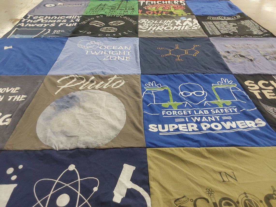 T-shirt quilt with science, education themes by Laura from MA
