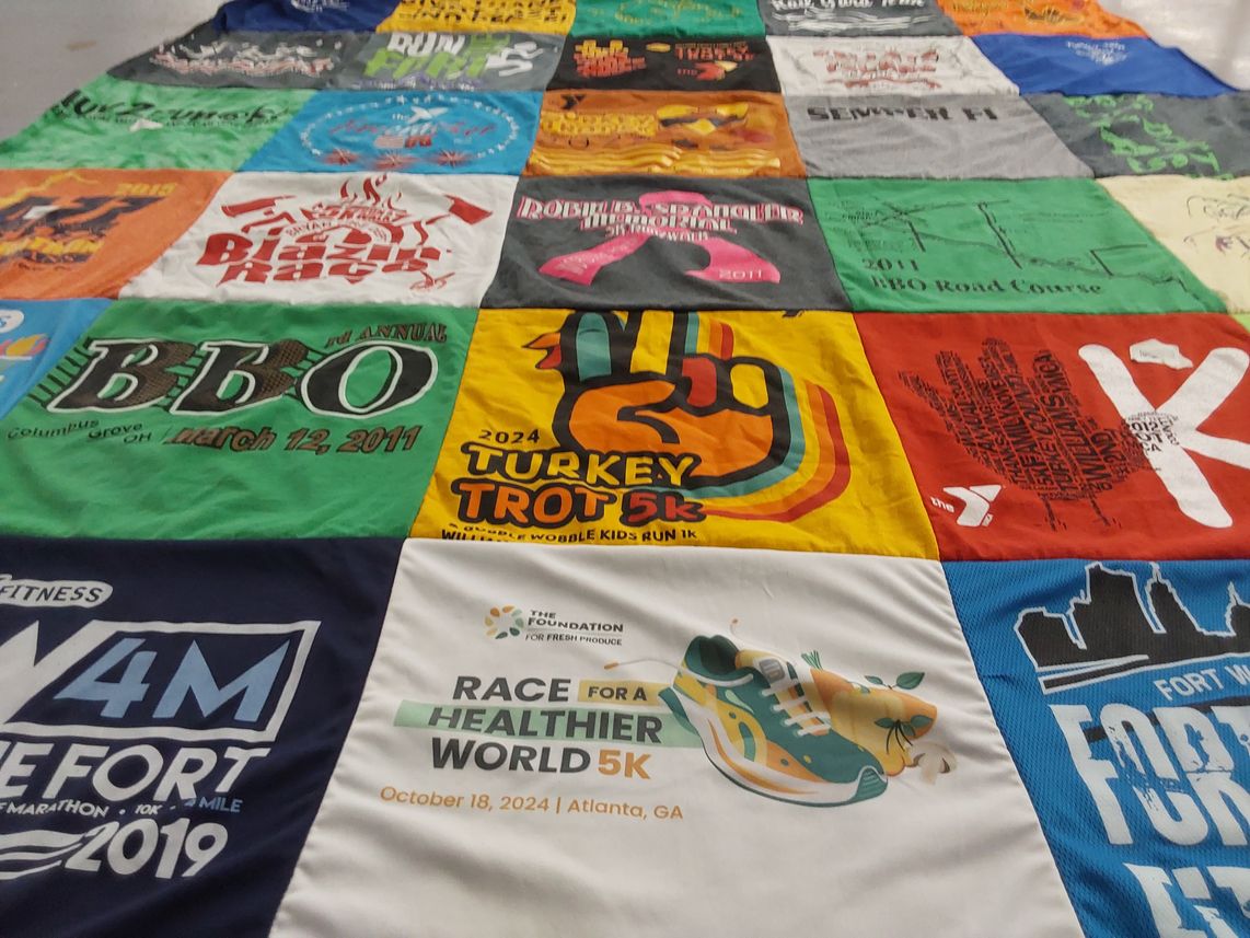 T-shirt quilt with running, fitness themes by Marie from OH