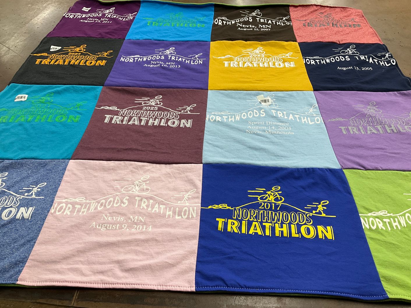 T-shirt quilt with triathlons, sports themes by Rachel from MN