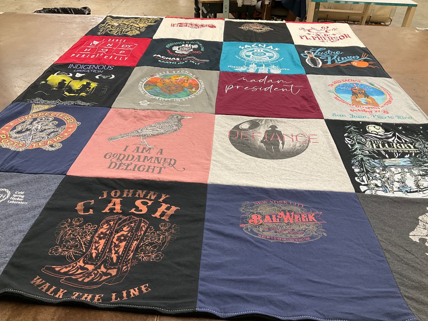 T-shirt quilt with music, activism themes by Charla from NY